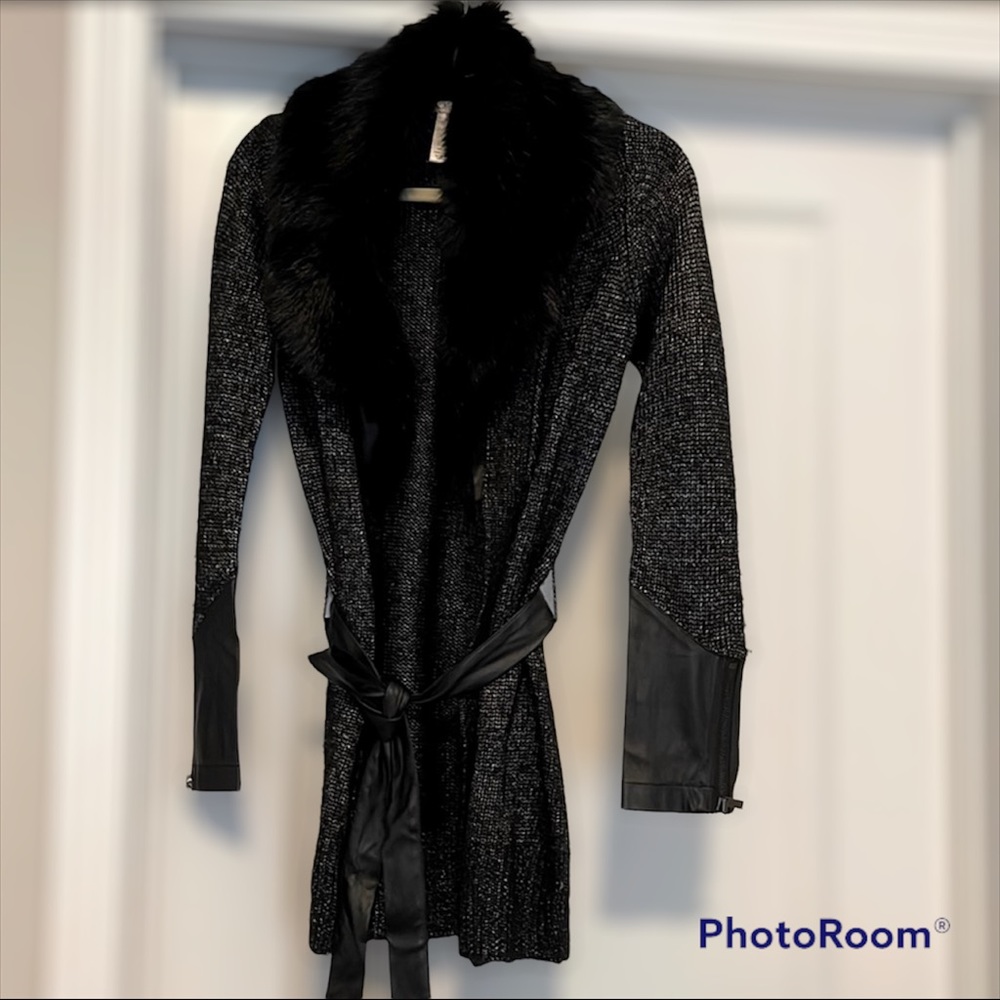 Sweater with fur and leather details. Not brand new but great condition.
